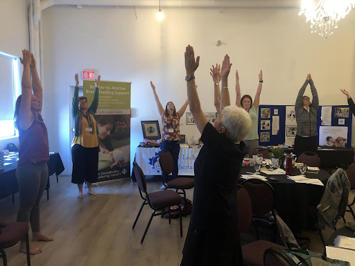 Colleen Stadlwieser leading a yoga sequence as part of our afternoon break Lunch AB