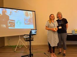 Trisha Correy-Pall and Joan Little during the welcome and opening remarks AB Day